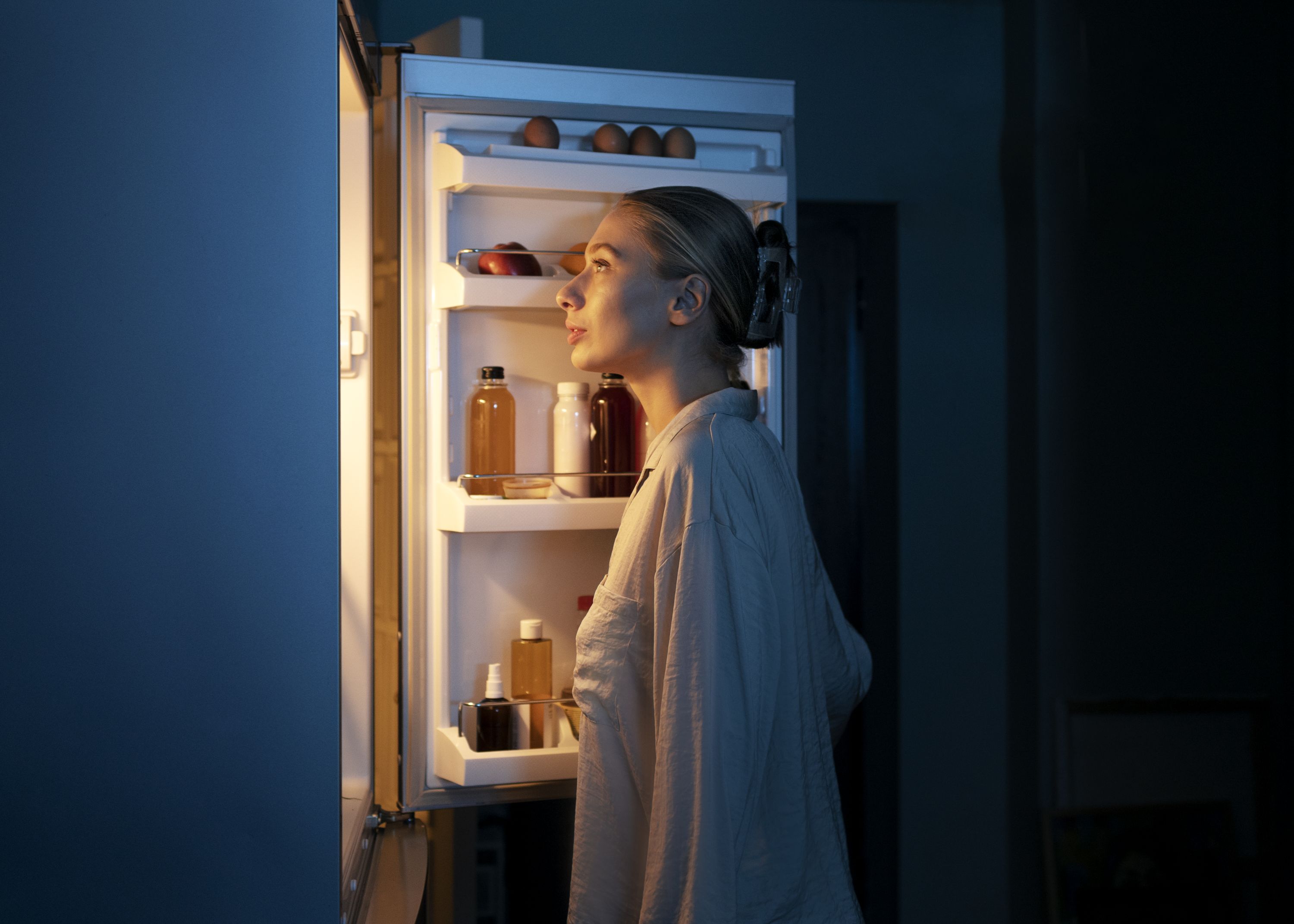 side-view-woman-looking-fridge